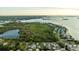Aerial view of waterfront property with a lake at 608 Florida Blvd, Crystal Beach, FL 34681