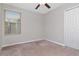 Well-lit bedroom with window and closet at 6180 Apple Snail Ave, New Port Richey, FL 34653