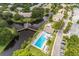 Beautiful aerial view of community including the pool and deck area, waterways, and neighborhood at 6210 92Nd N Pl # 3405, Pinellas Park, FL 33782