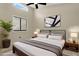 Comfortable bedroom featuring large windows, a ceiling fan, and neutral decor at 6210 92Nd N Pl # 3405, Pinellas Park, FL 33782