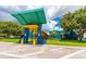 Brightly colored building exterior with awnings and landscaping offering a welcoming and fun environment at 6210 92Nd N Pl # 3405, Pinellas Park, FL 33782