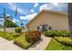 Inviting entrance of a building featuring manicured landscaping, and a bright exterior at 6210 92Nd N Pl # 3405, Pinellas Park, FL 33782