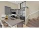 A modern kitchen with gray cabinets, stainless steel appliances, and granite countertops at 6210 92Nd N Pl # 3405, Pinellas Park, FL 33782