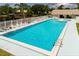 Large community pool is ready for swimming, has lounge chairs, and is near the clubhouse at 6210 92Nd N Pl # 3405, Pinellas Park, FL 33782