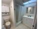 Bathroom with a shower/tub combo, vanity, and tiled floors at 7050 Sunset S Dr # 208, South Pasadena, FL 33707
