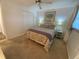 Bedroom with a double bed, floral bedding, and carpet flooring at 7050 Sunset S Dr # 208, South Pasadena, FL 33707