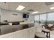 Community kitchen with a breakfast bar and appliances at 7050 Sunset S Dr # 208, South Pasadena, FL 33707