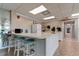Well-equipped community kitchen with breakfast bar at 7050 Sunset S Dr # 208, South Pasadena, FL 33707