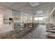 Spacious community room with seating and pool view at 7050 Sunset S Dr # 208, South Pasadena, FL 33707