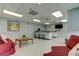 Community room with kitchen, seating area, and TV at 7050 Sunset S Dr # 208, South Pasadena, FL 33707