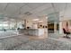 Community room with kitchenette and mirror wall at 7050 Sunset S Dr # 208, South Pasadena, FL 33707