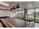 Relaxing game room features a pool table and comfortable seating at 7050 Sunset S Dr # 208, South Pasadena, FL 33707
