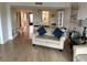 Bright living room with comfortable sofas and hardwood floors at 7050 Sunset S Dr # 208, South Pasadena, FL 33707