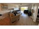Bright living room with comfortable sofas and hardwood floors at 7050 Sunset S Dr # 208, South Pasadena, FL 33707