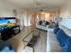 Bright living room with comfortable sofas and hardwood floors at 7050 Sunset S Dr # 208, South Pasadena, FL 33707