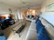 Bright living room with comfortable sofas and hardwood floors at 7050 Sunset S Dr # 208, South Pasadena, FL 33707