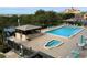 Inviting pool and spa with surrounding patio furniture at 7050 Sunset S Dr # 208, South Pasadena, FL 33707