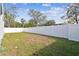 Spacious backyard with a large privacy fence at 7711 N Orleans Ave, Tampa, FL 33604