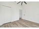 Bright bedroom with double door closet and wood-look floors at 7711 N Orleans Ave, Tampa, FL 33604