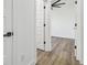 Clean hallway with hardwood floors and white doors at 7711 N Orleans Ave, Tampa, FL 33604
