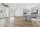 Modern kitchen with gray cabinets, white countertops, and island at 7711 N Orleans Ave, Tampa, FL 33604