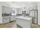Modern kitchen with gray cabinets and stainless steel appliances at 7711 N Orleans Ave, Tampa, FL 33604