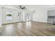 Spacious living room with hardwood floors and access to a patio at 7711 N Orleans Ave, Tampa, FL 33604