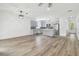 Open floor plan with kitchen, dining and living room areas at 7711 N Orleans Ave, Tampa, FL 33604