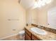 Clean bathroom with a vanity, toilet, and mirror at 8110 Hampton View Ln, Tampa, FL 33647