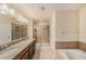 Elegant bathroom with granite countertops and shower at 8110 Hampton View Ln, Tampa, FL 33647