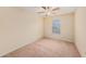 Well-lit bedroom with ceiling fan and window at 8110 Hampton View Ln, Tampa, FL 33647