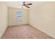 Well-lit bedroom with ceiling fan and window at 8110 Hampton View Ln, Tampa, FL 33647