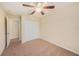 Bedroom with ceiling fan and double door closet at 8110 Hampton View Ln, Tampa, FL 33647