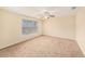 Spacious bedroom with large window and ceiling fan at 8110 Hampton View Ln, Tampa, FL 33647