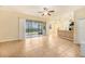 Bright living room with tile floors and view of backyard at 8110 Hampton View Ln, Tampa, FL 33647