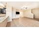 Open concept living room with tile floors and kitchen view at 8110 Hampton View Ln, Tampa, FL 33647