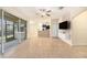 Open living area with tile floors, kitchen island, and sliding glass doors at 8110 Hampton View Ln, Tampa, FL 33647