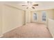 Bright loft area with carpet, ceiling fan and windows at 8110 Hampton View Ln, Tampa, FL 33647
