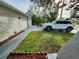 Side view of a house with a white car parked in the driveway at 9334 Ledgestone Ln, Port Richey, FL 34668