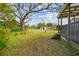 Large backyard with mature trees and shed at 9415 Forest Hills Dr, Tampa, FL 33612