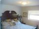 Spacious bedroom with a large bed and decorative pillows at 960 Lakewood Dr, Dunedin, FL 34698