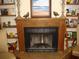 Traditional wood-burning fireplace with a wood mantle at 960 Lakewood Dr, Dunedin, FL 34698