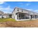 View of the home from the backyard, showing the screened porch at 9642 Sweetwell Pl, Riverview, FL 33569
