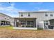 Home with screened porch and grassy backyard at 9642 Sweetwell Pl, Riverview, FL 33569