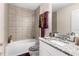 Clean bathroom, shower/tub combo and granite vanity at 9642 Sweetwell Pl, Riverview, FL 33569