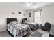Bright bedroom with two twin beds and large window at 9642 Sweetwell Pl, Riverview, FL 33569