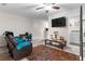 Spacious bonus room with TV and comfortable seating at 9642 Sweetwell Pl, Riverview, FL 33569