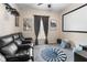 Dedicated home theater with comfortable seating and projector at 9642 Sweetwell Pl, Riverview, FL 33569