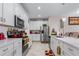 Modern kitchen with white cabinets and island at 9642 Sweetwell Pl, Riverview, FL 33569