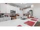 Modern kitchen with white cabinets and quartz countertops at 9642 Sweetwell Pl, Riverview, FL 33569